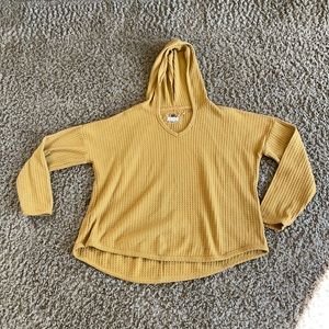 gold sweater